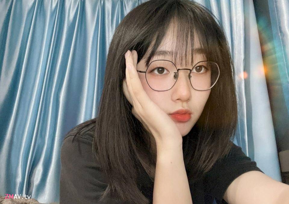 Sweet glasses girl rubs her big breasts, body curves are very attractive